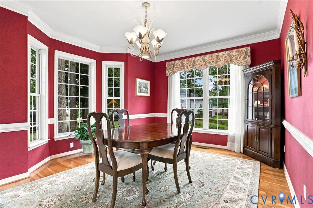 5712 Stephens Point Court, Stephens Point, Chester, VA 23831 Multiple windows and a bay window fill the formal dining room with natural light.