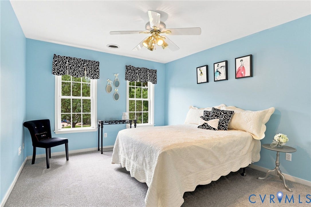 5712 Stephens Point Court, Stephens Point, Chester, VA 23831 Bright secondary bedroom with two windows, ceiling fan, and generous space for furnishings.
