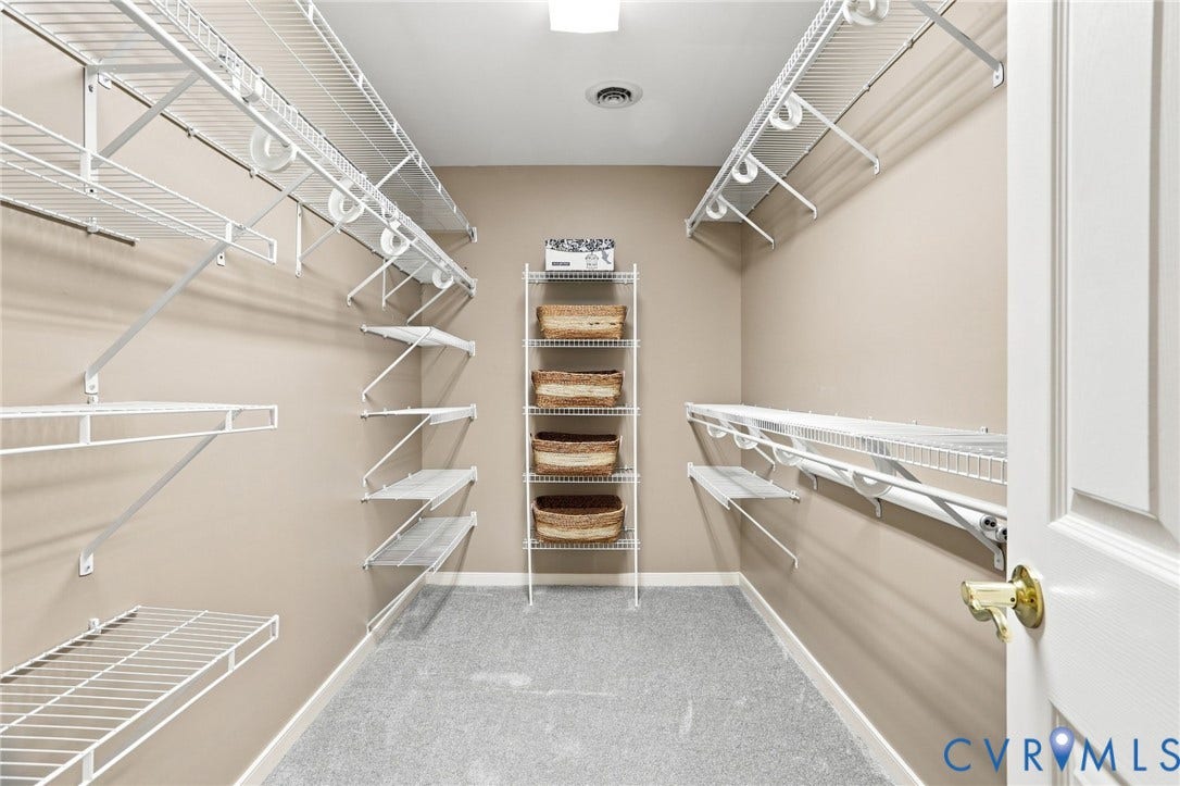 5712 Stephens Point Court, Stephens Point, Chester, VA 23831 Generously sized walk-in closet offers extensive shelving and hanging space for organized storage.