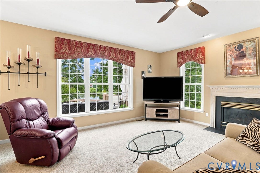 5712 Stephens Point Court, Stephens Point, Chester, VA 23831 Spacious family room is filled with natural light and features a gas fireplace and views of the lake!