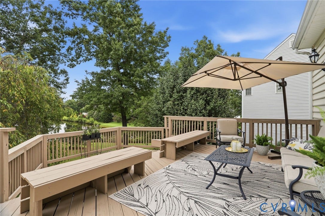 5712 Stephens Point Court, Stephens Point, Chester, VA 23831 Expansive rear deck provides plenty of space for outdoor dining, entertaining, and relaxing while overlooking the water