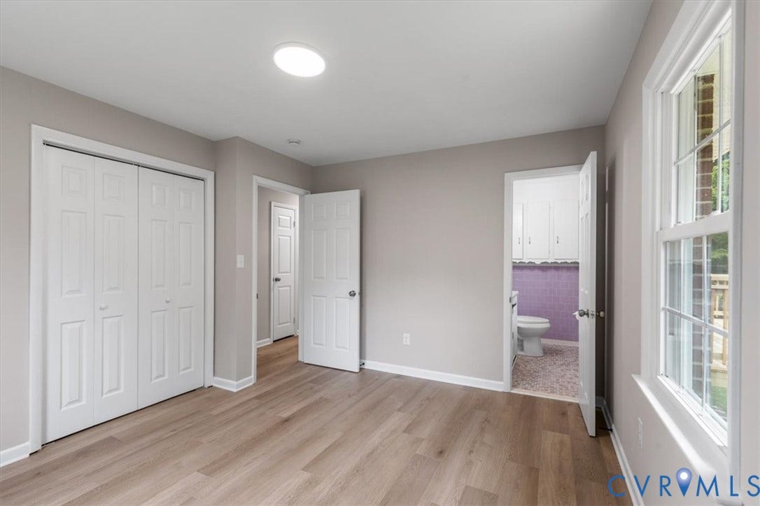 3308 Sylvania Road, Chesterfield, VA 23831 Wood-finish flooring, white bi-fold closet doors, recessed ceiling lighting, and a multi-pane window