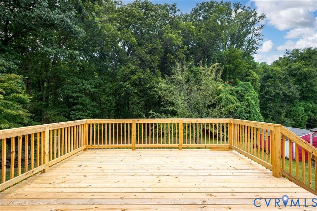 3308 Sylvania Road, Chesterfield, VA 23831 Expansive wooden deck with a complete baluster railing system, offering an outdoor living space