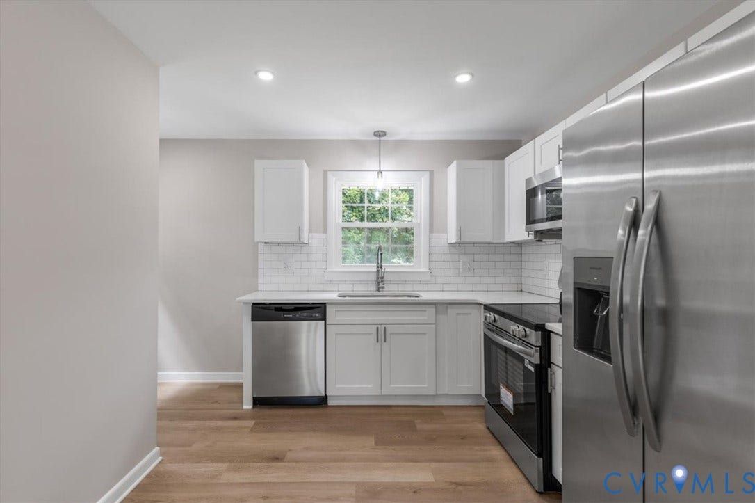 3308 Sylvania Road, Chesterfield, VA 23831 Kitchen featuring stainless steel appliances, wood-finish flooring, white cabinetry, a subway tile backsplash, and recessed lighting
