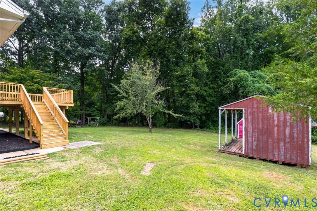 3308 Sylvania Road, Chesterfield, VA 23831 Expansive backyard featuring a new wood deck, additional storage shed, and mature trees