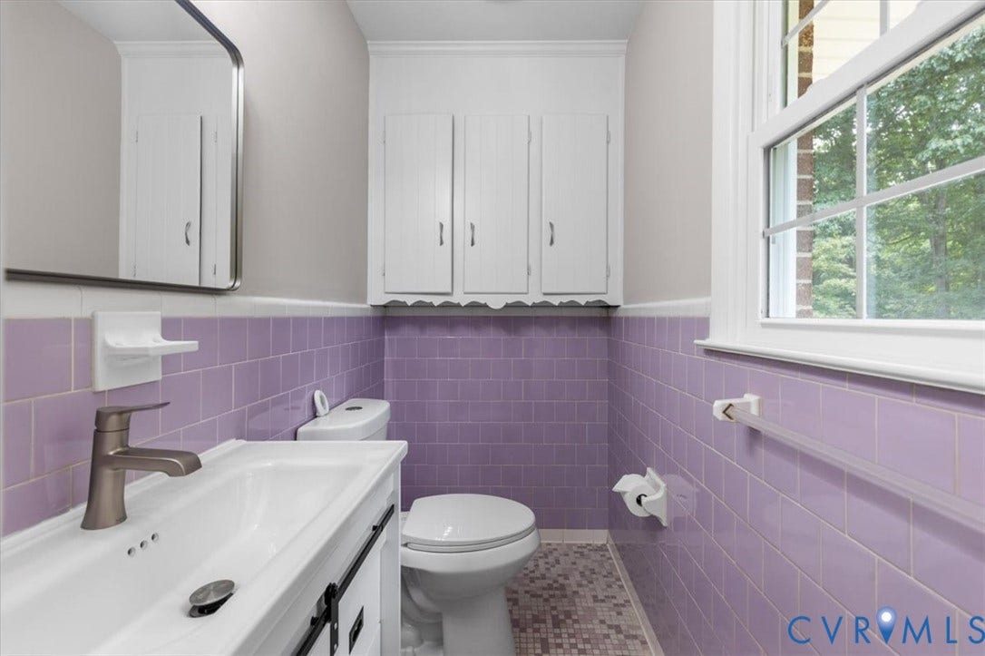 3308 Sylvania Road, Chesterfield, VA 23831 White shaker-style vanity with a single basin sink and brushed nickel faucet