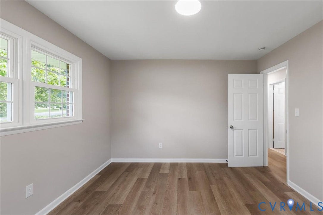 3308 Sylvania Road, Chesterfield, VA 23831 Neutral wall tones, wood-finish flooring, white trim, and a flush mount ceiling light
