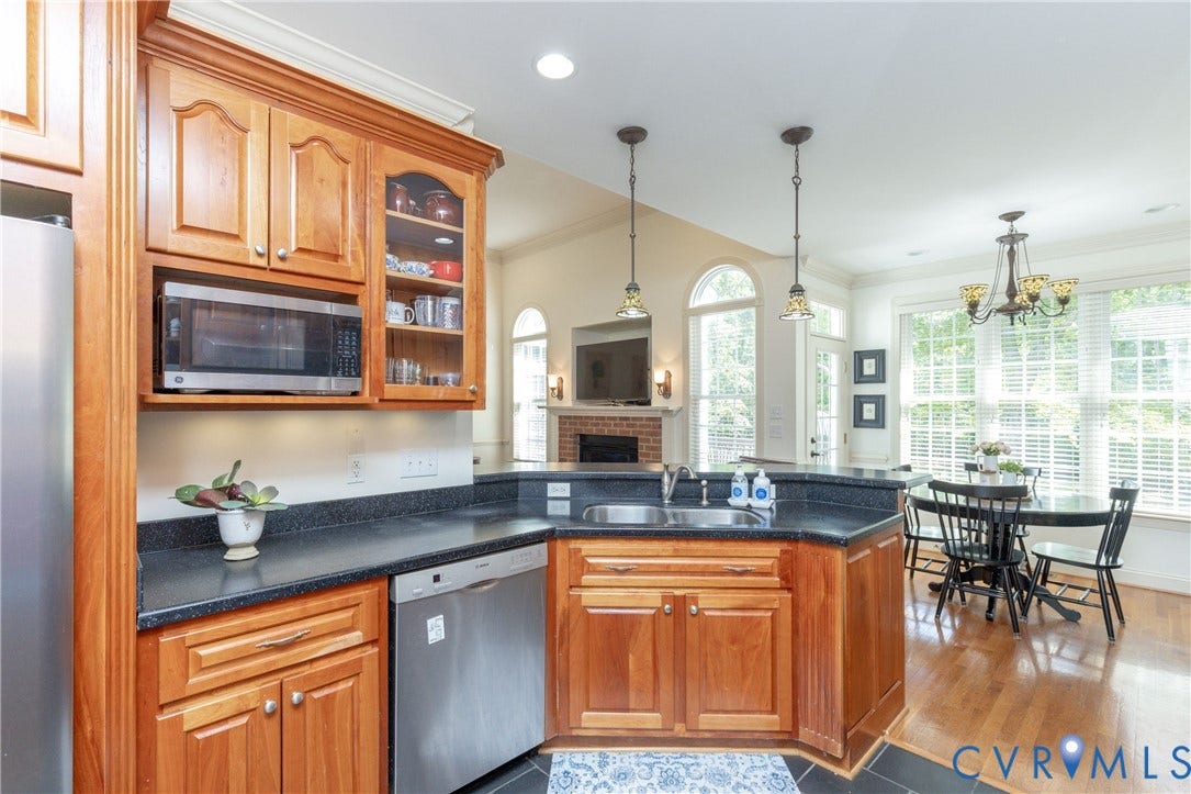 Custom Cherry Cabinets and counters abound!