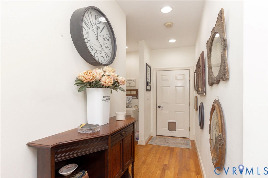 Hall leads to Laundry room and garage