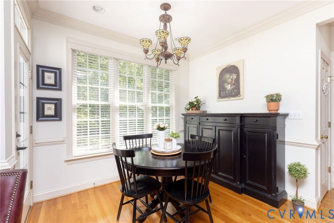 Sunny Breakfast Nook.  Note the beautiful mouldings throughout the home