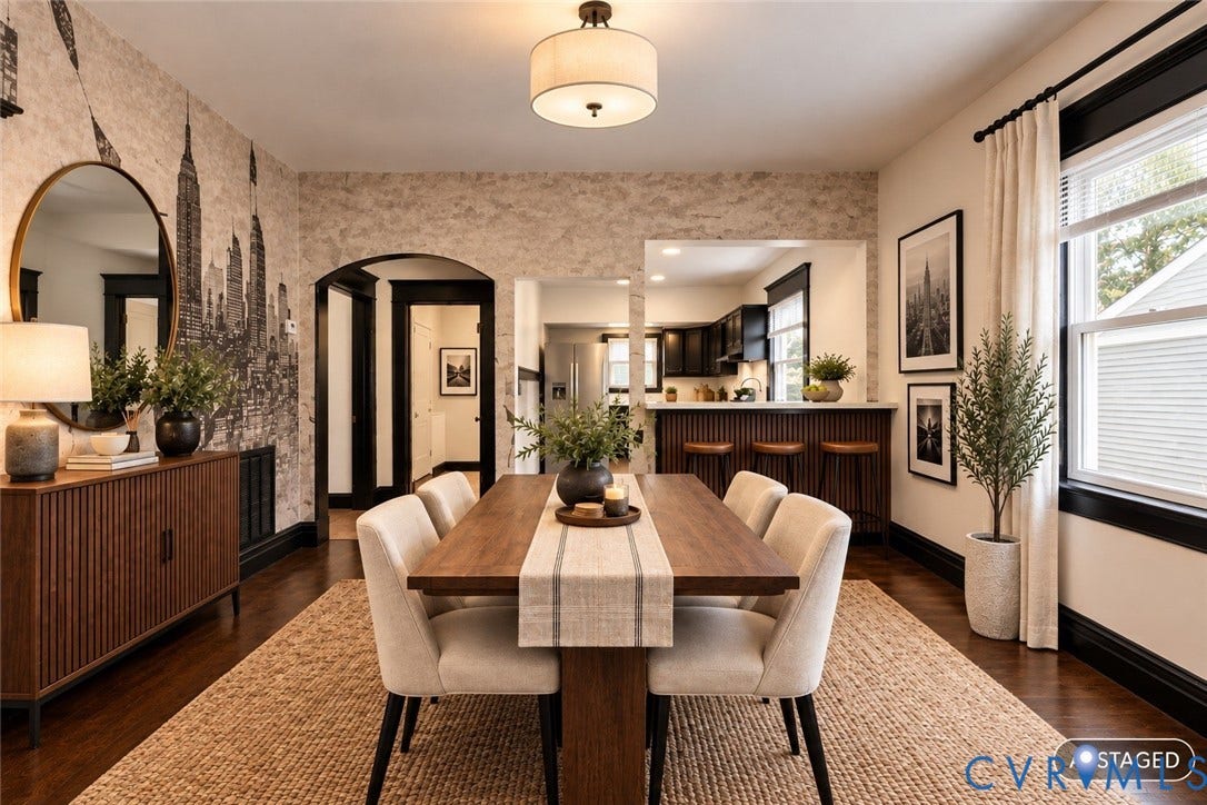 Hardwood-finish flooring, recessed lighting, arched doorway, pass-through window with bar seating, and a ceiling-mounted light fixture