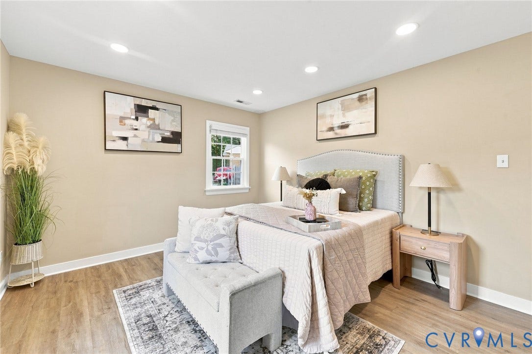 3221 Clintwood Road, Midlothian, VA 23112 Recessed lighting illuminates the space, featuring wood-finish flooring and a window with white trim