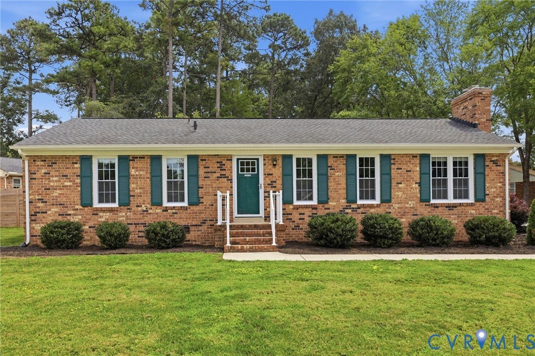 3221 Clintwood Road, Midlothian, VA 23112 Brick exterior with dark green shutters, a matching front door, and a brick chimney