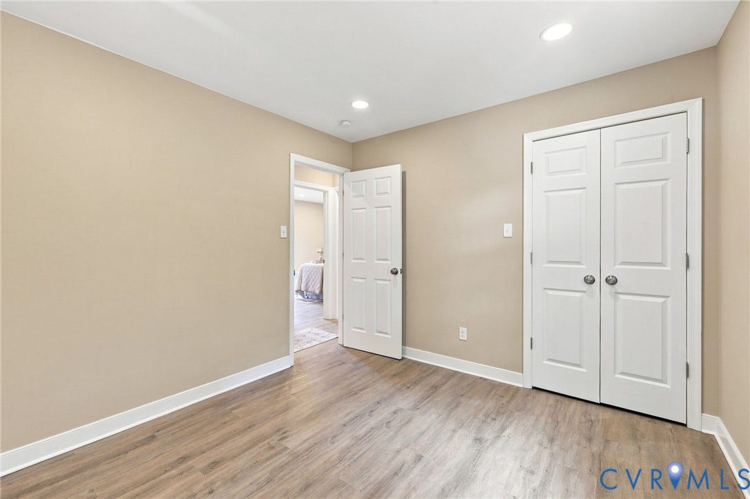 3221 Clintwood Road, Midlothian, VA 23112 Wood-finish flooring, recessed lighting, and white trim accents