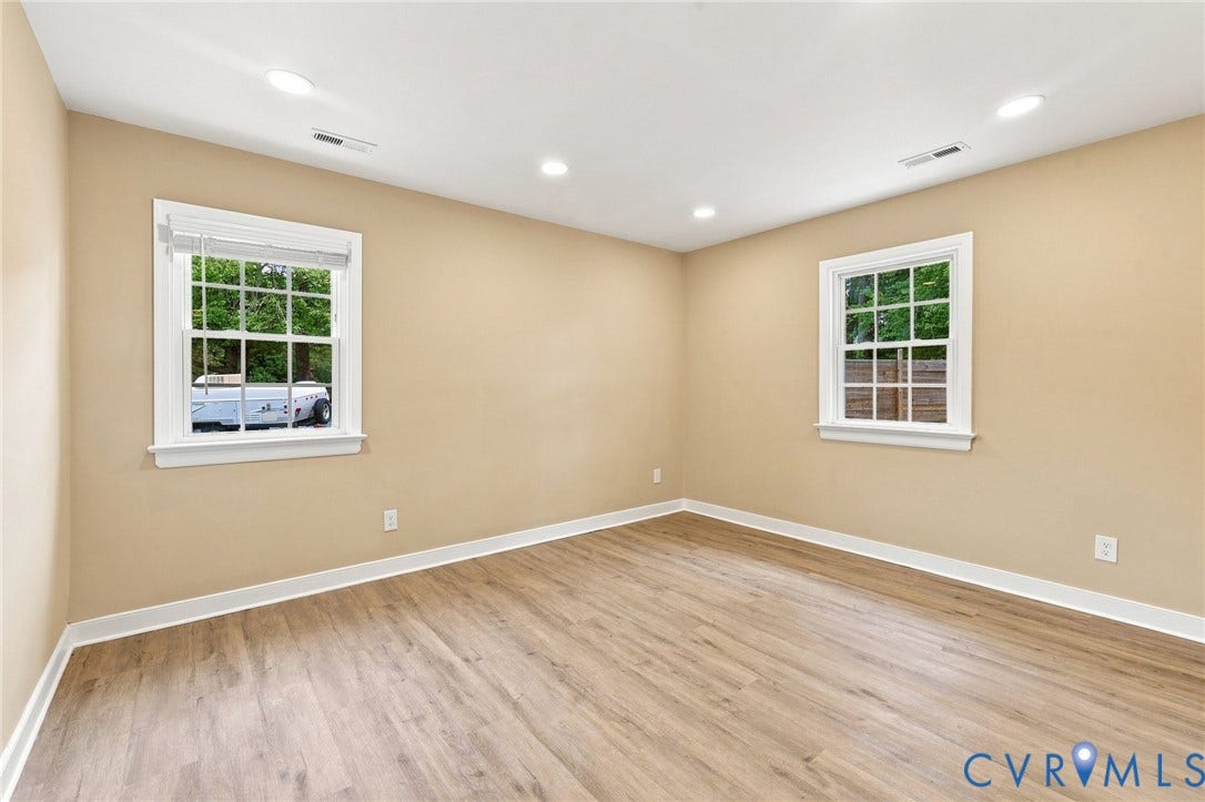 3221 Clintwood Road, Midlothian, VA 23112 Warm neutral wall color, wood-finish flooring, recessed lighting, and white trim molding