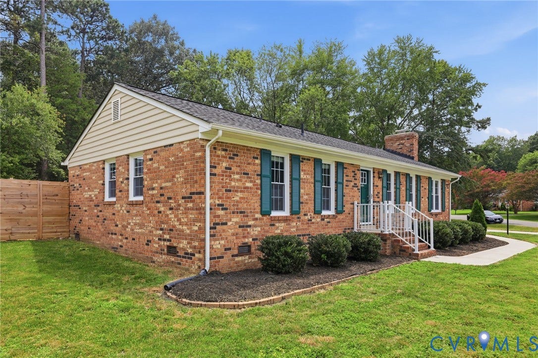 3221 Clintwood Road, Midlothian, VA 23112 Brick exterior with white trim, teal shutters, and a front porch with white railings