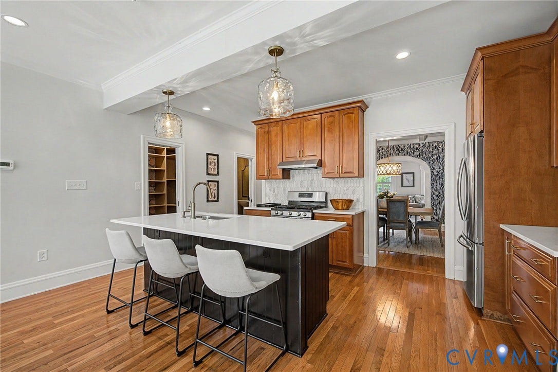 Wood-finish flooring throughout the kitchen