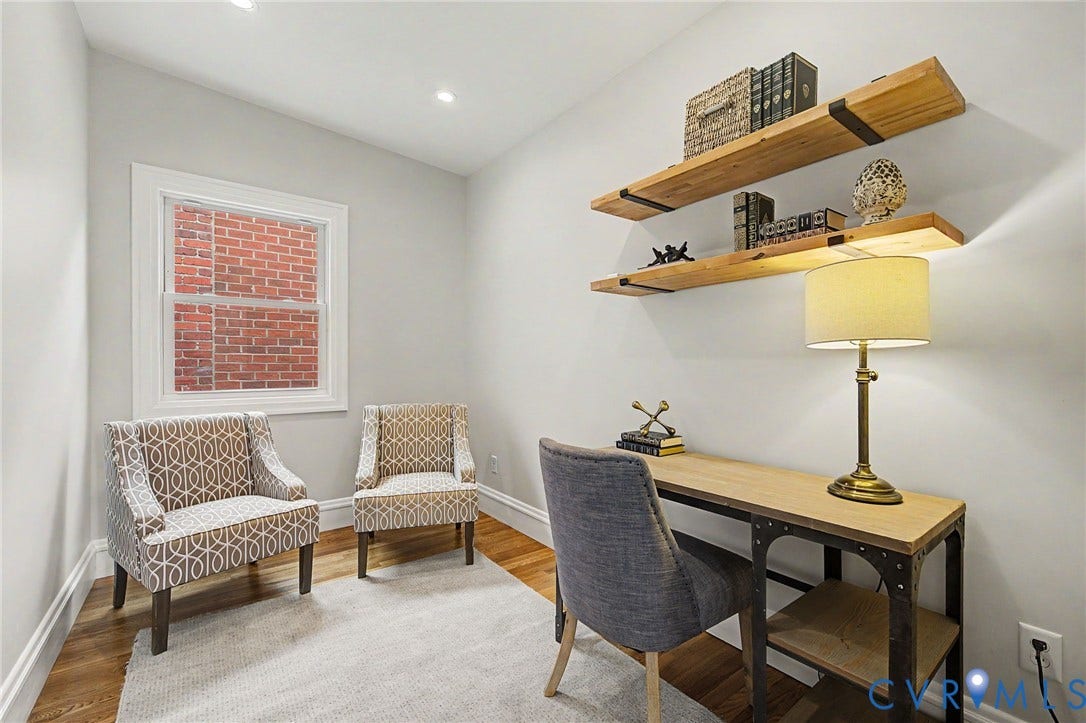 Recessed ceiling lighting, wood-finish flooring, white trim, and two built-in floating shelves
