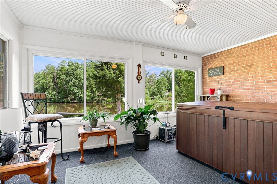 4512 Forrestal Road, Chester, VA 23831 Enclosed sunroom featuring a ceiling fan, wood-paneled ceiling, and large windows