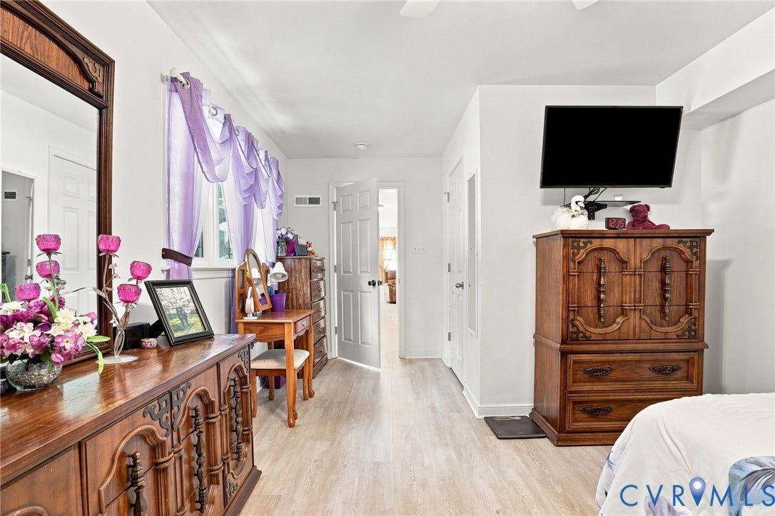 4512 Forrestal Road, Chester, VA 23831 Wood-finish flooring throughout, white interior doors, and overhead lighting