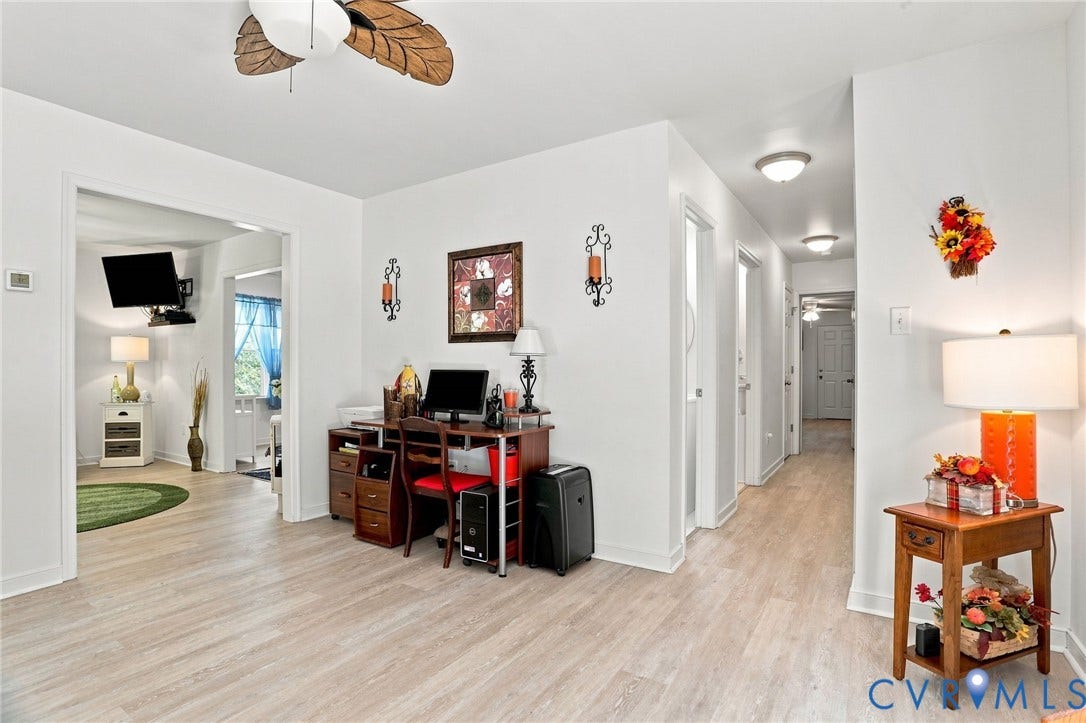 4512 Forrestal Road, Chester, VA 23831 Bright entryway showcasing wood-finish flooring throughout, multiple doorways providing access to adjoining spaces, and abundant natural light from windows