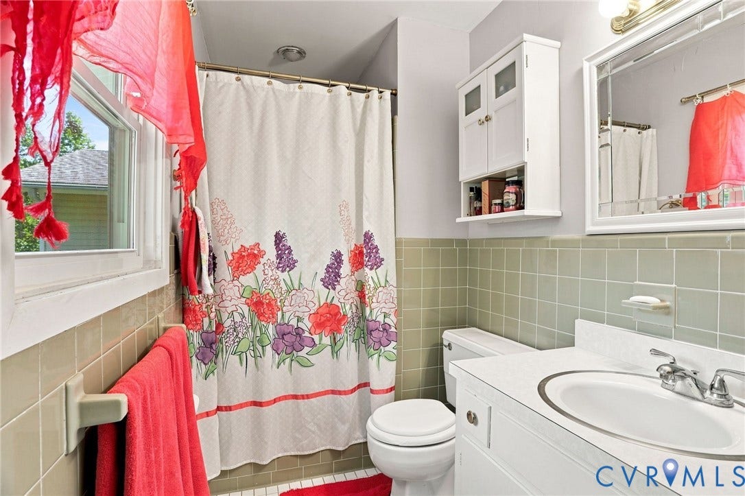 4512 Forrestal Road, Chester, VA 23831 White vanity with integrated sink and chrome faucet