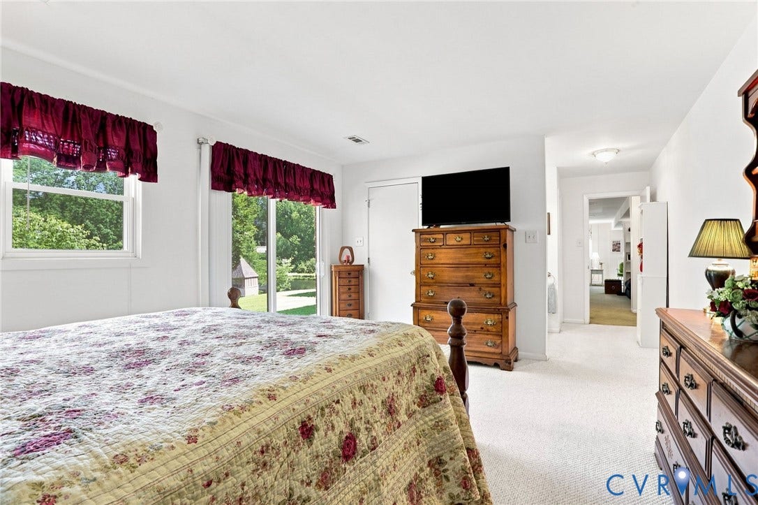 4512 Forrestal Road, Chester, VA 23831 White painted walls, white ceiling, white trim, and light-colored carpet flooring