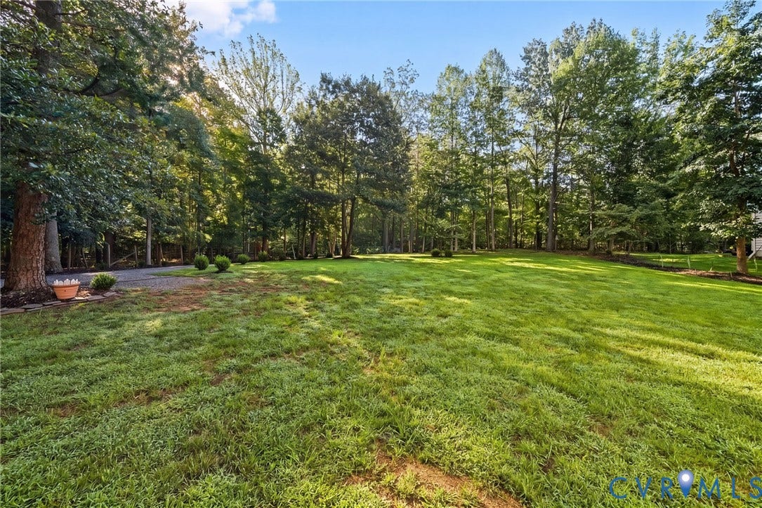 1577 Moody Town Road, Bumpass, VA 23024 Expansive green lawn surrounded by mature trees