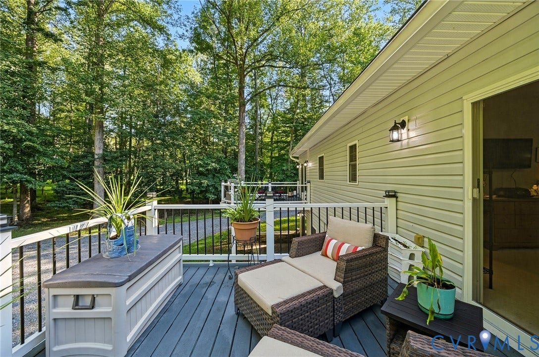 1577 Moody Town Road, Bumpass, VA 23024 Private deck with gray composite decking, white railings, and black balusters