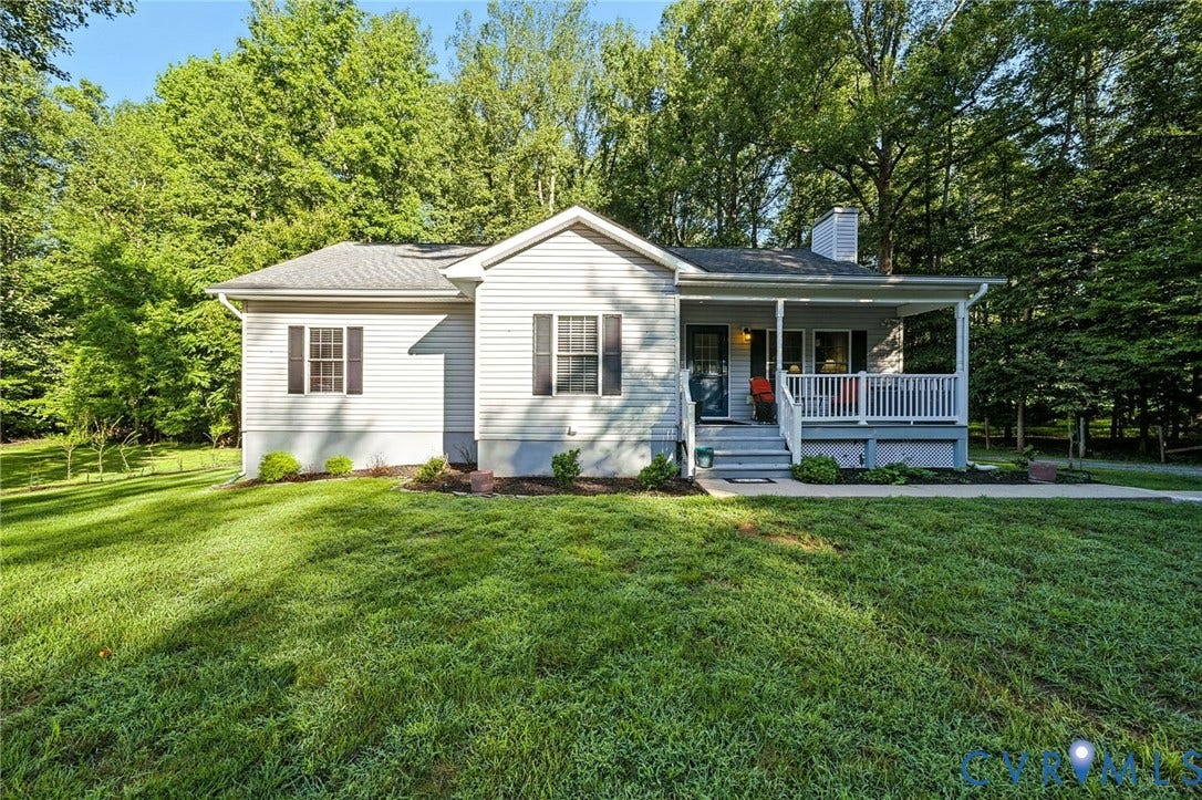 1577 Moody Town Road, Bumpass, VA 23024 Siding exterior with a covered front porch, white railing, and dark shutters