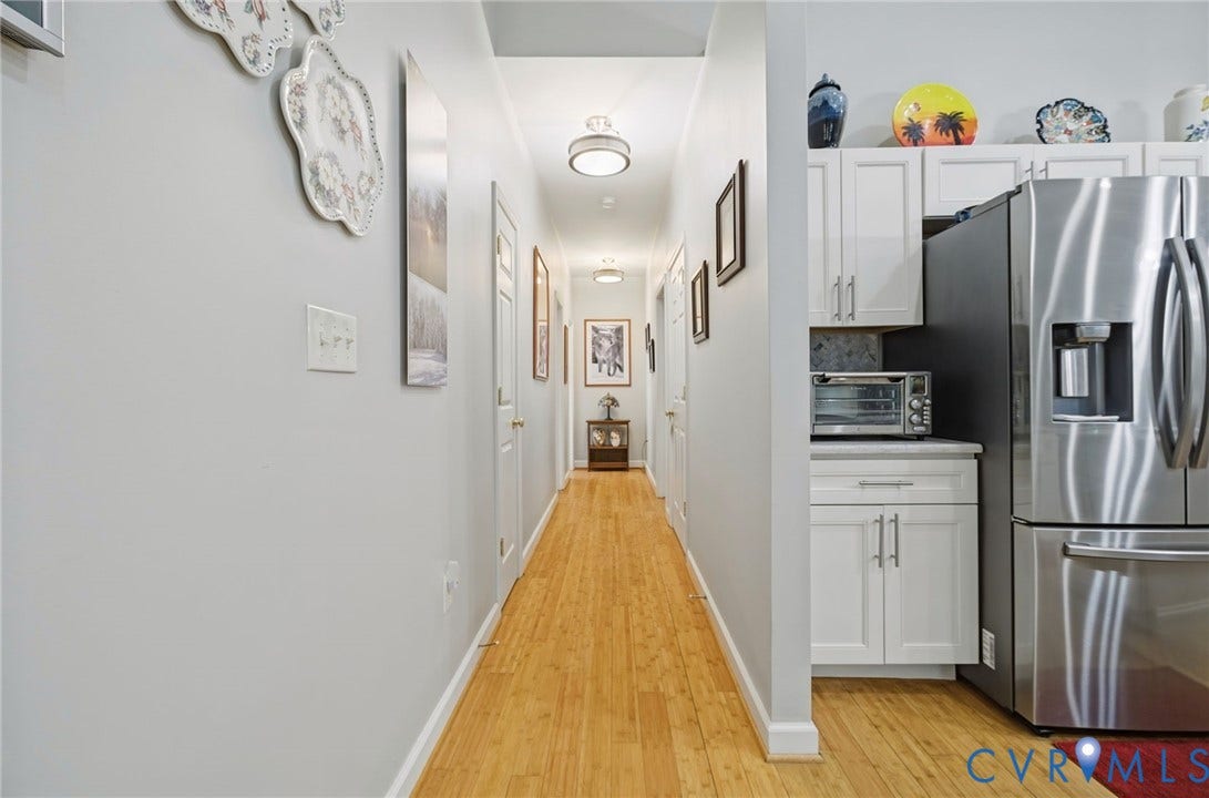 1577 Moody Town Road, Bumpass, VA 23024 Light wood-finish flooring extending through the hallway and kitchen area