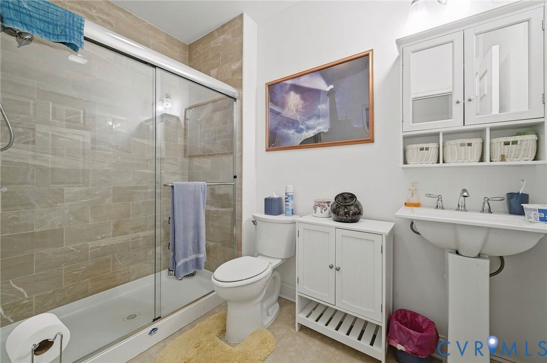 1577 Moody Town Road, Bumpass, VA 23024 Shower enclosure with sliding glass door and tile surround