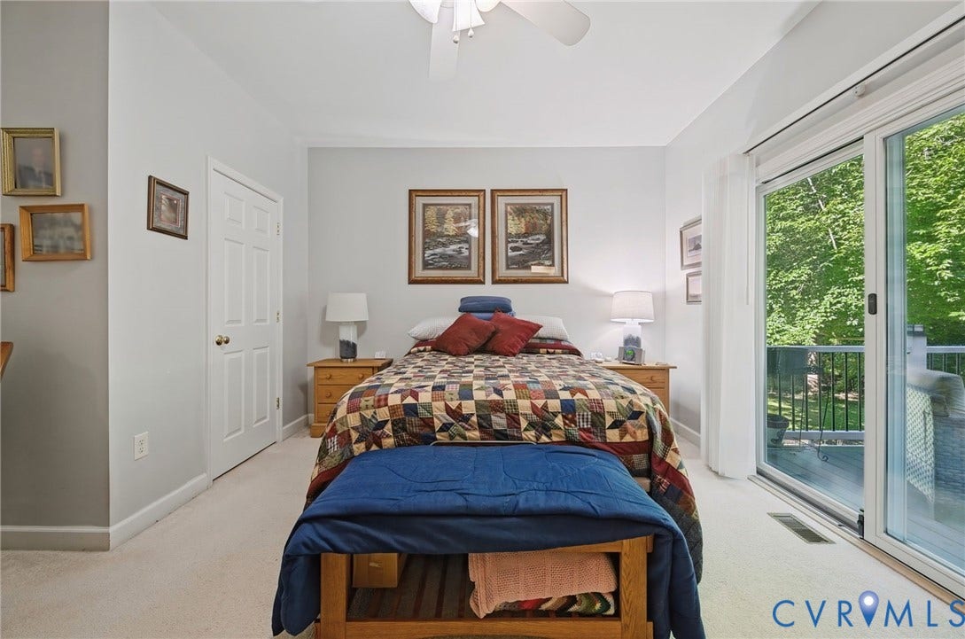 1577 Moody Town Road, Bumpass, VA 23024 Recessed lighting, ceiling fan, sliding glass door, white trim, and light-colored carpeting