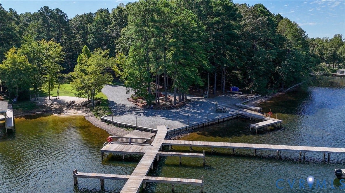 1577 Moody Town Road, Bumpass, VA 23024 Lakefront property featuring a private dock, expansive water frontage, and mature trees