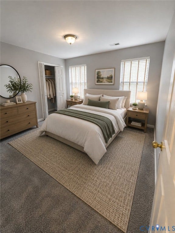 Carpeted flooring, dual windows with blinds, a bi-fold closet, and a ceiling-mounted light fixture. *Virtually enhanced