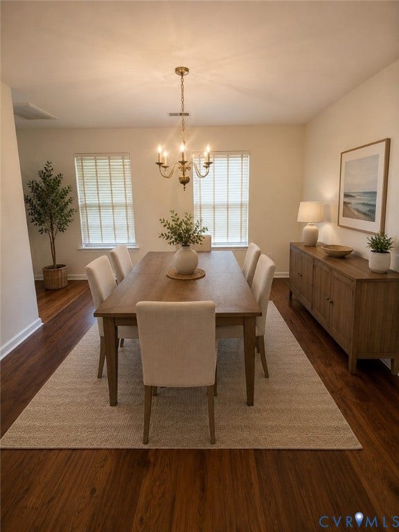 Warm LVP wood-finish flooring complements the neutral wall tones. *Virtually enhanced