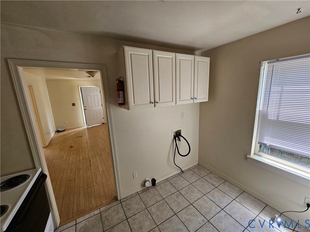 1711 Halifax Avenue, Richmond, VA 23224 Utility area with tile flooring, upper cabinetry, and a window with blinds