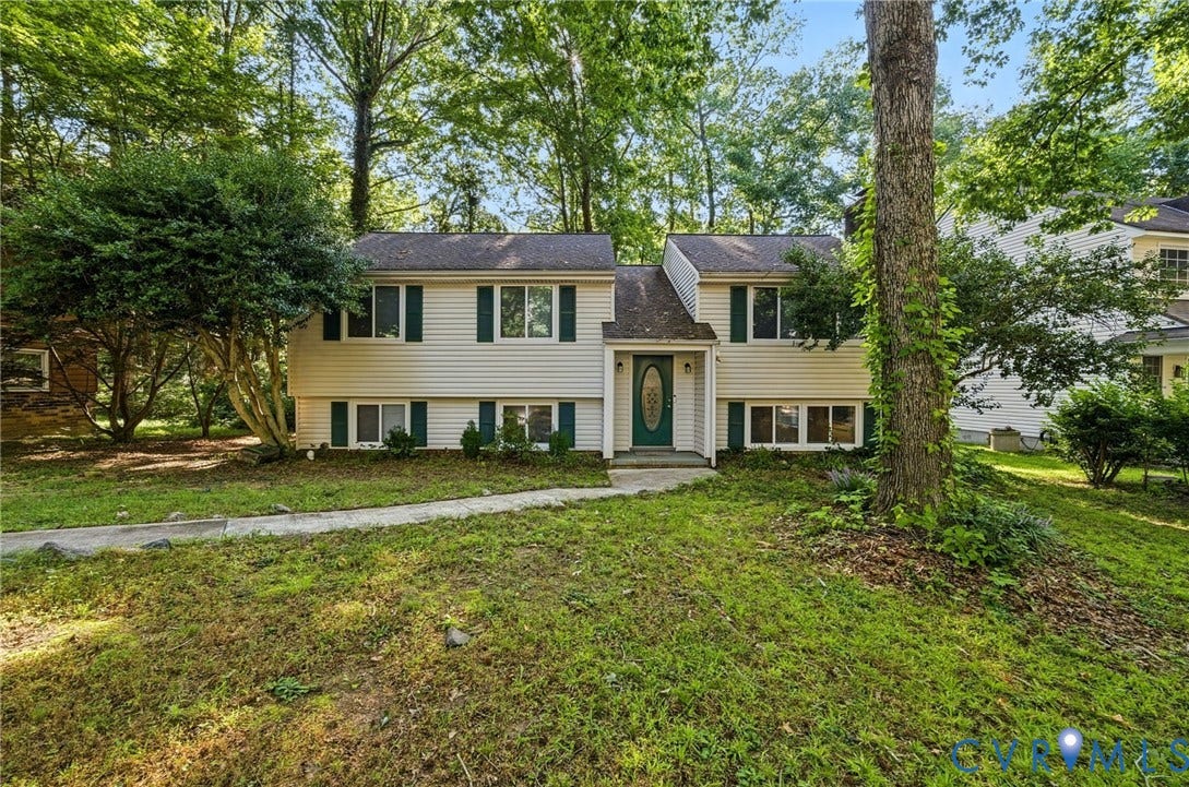 2709 Sutters Mill Court, Midlothian, VA 23112 Split-level residence featuring light-colored siding, dark shutters, and a prominent front entry with an oval glass insert door