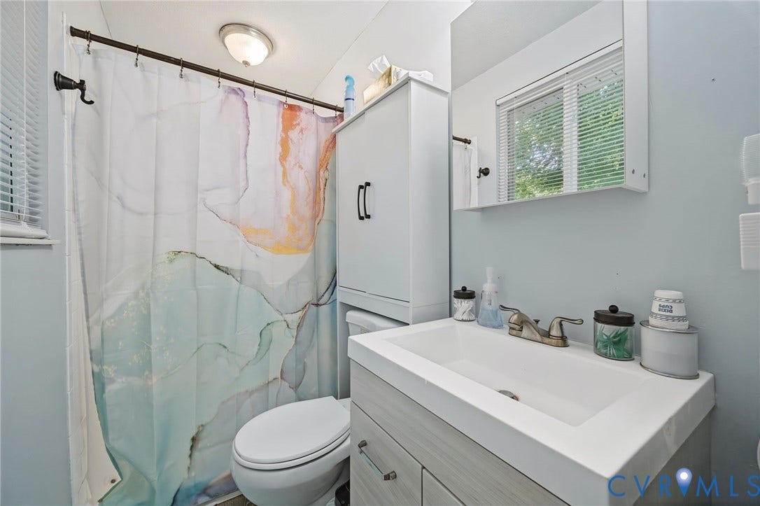 2709 Sutters Mill Court, Midlothian, VA 23112 Built-in vanity with integrated sink, wall-mounted mirror, window with blinds, and flush-mount ceiling light