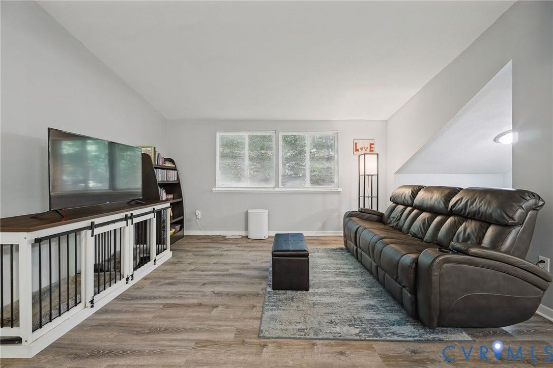 2709 Sutters Mill Court, Midlothian, VA 23112 Wood-finish flooring throughout, light gray wall color, dual pane window, built-in shelving, vaulted ceiling