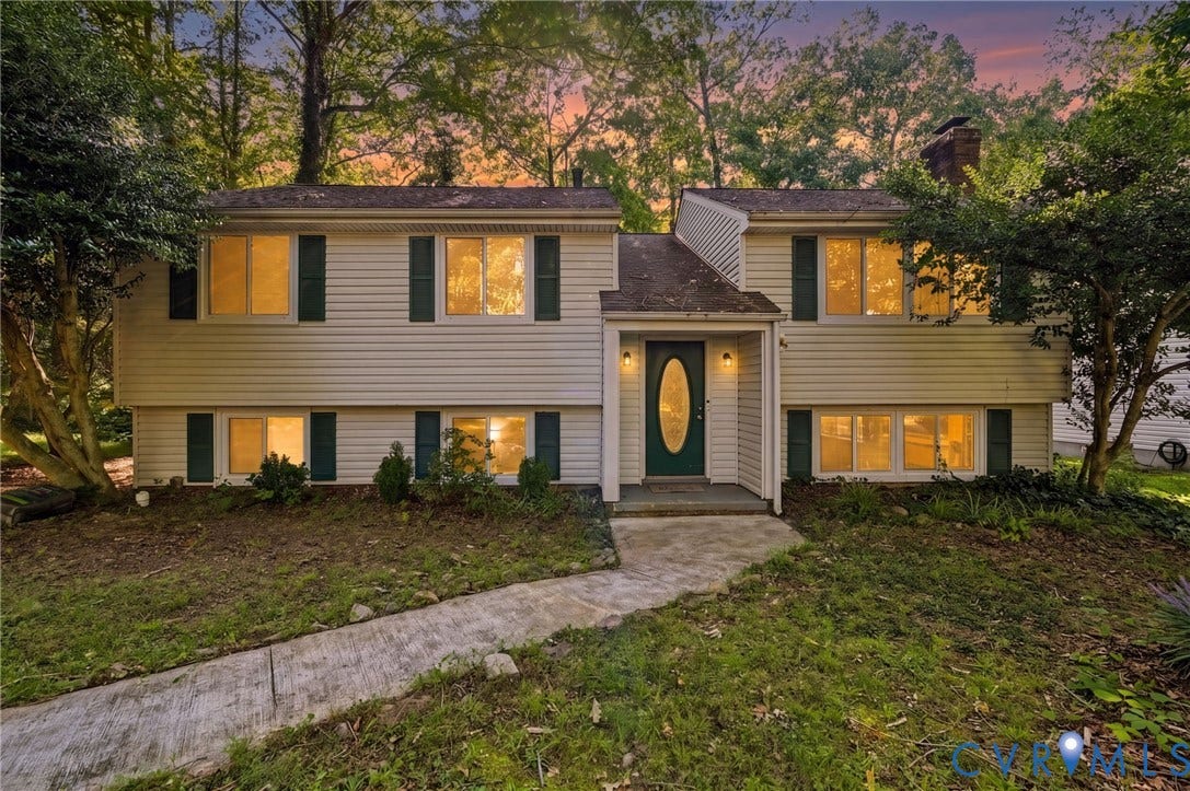 2709 Sutters Mill Court, Midlothian, VA 23112 Split-level home featuring light-toned siding, dark green shutters, and a prominent front entry with a dark green door