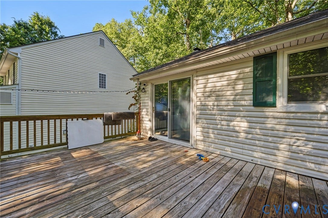2709 Sutters Mill Court, Midlothian, VA 23112 Spacious wooden deck with a slatted railing, siding exterior, and sliding glass door access