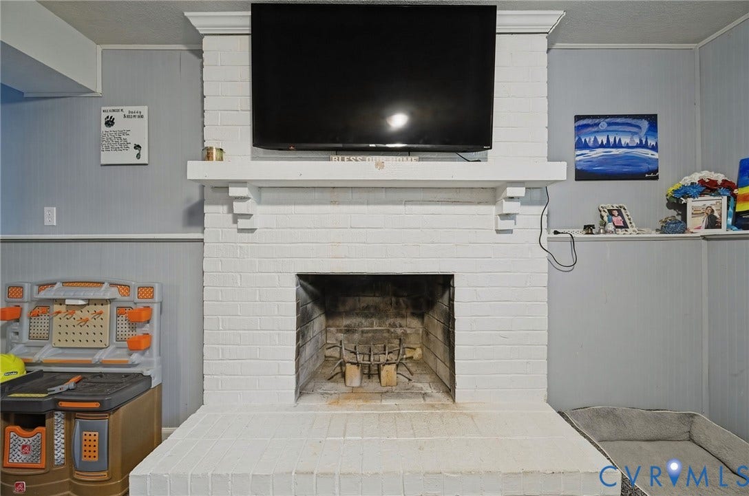 2709 Sutters Mill Court, Midlothian, VA 23112 Brick fireplace with a painted white finish, a substantial mantel, and a traditional firebox