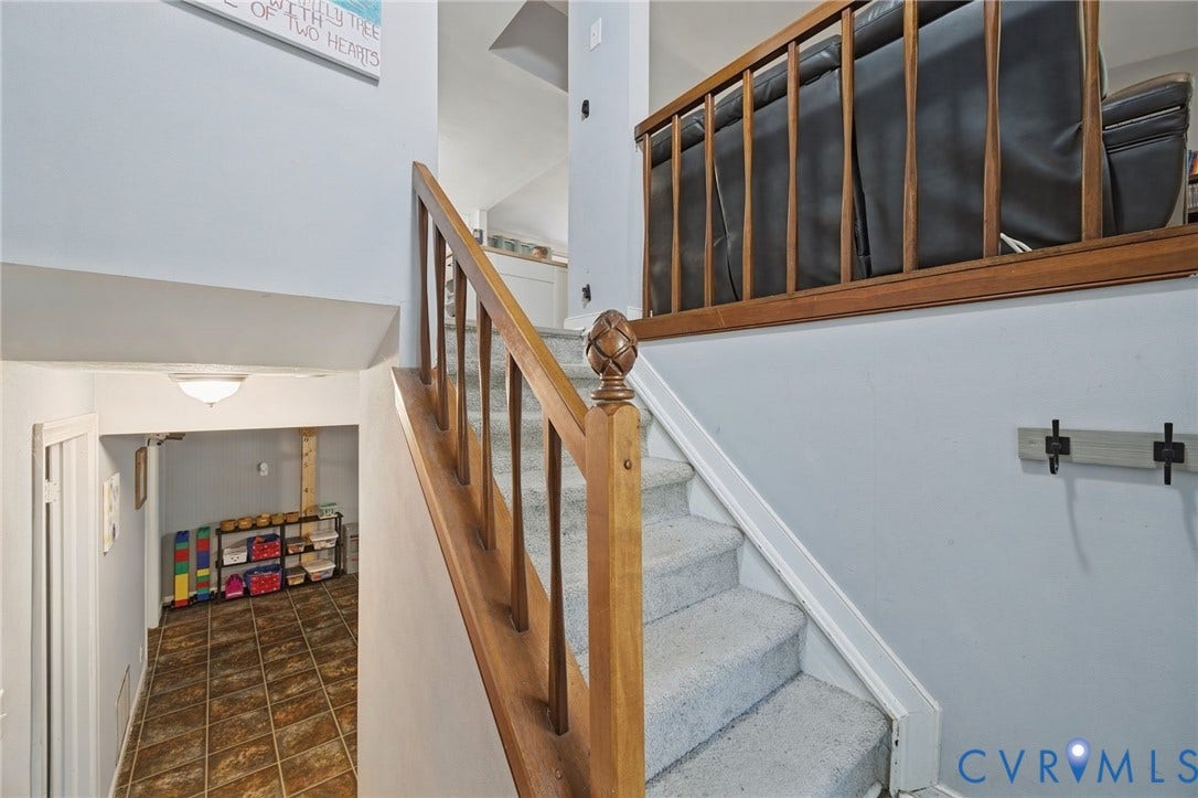 2709 Sutters Mill Court, Midlothian, VA 23112 Carpeted staircase with wood railing and finial newel post