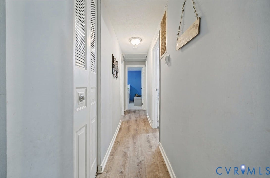 2709 Sutters Mill Court, Midlothian, VA 23112 Hallway featuring wood-finish flooring, white walls, and a flush mount ceiling light