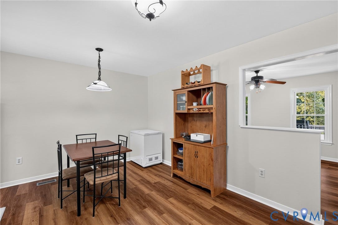 7248 Full Rack Drive, Midlothian, VA 23112 Wood-finish flooring throughout, complemented by a decorative pendant light fixture