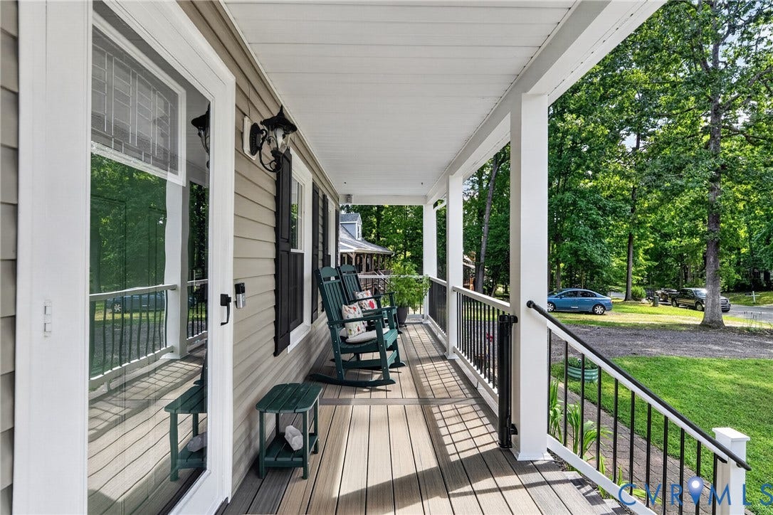 7248 Full Rack Drive, Midlothian, VA 23112 Covered front porch featuring composite decking, white columns, black railings, and light-colored siding
