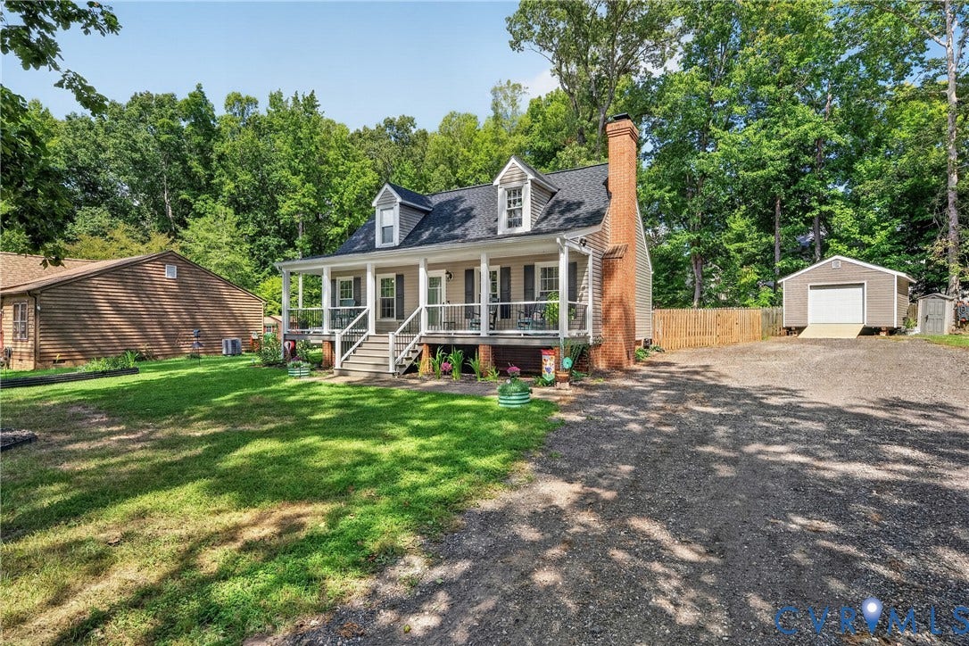 7248 Full Rack Drive, Midlothian, VA 23112 Cottage-style residence featuring a covered front porch with white railings, a prominent brick chimney, and a dormer window