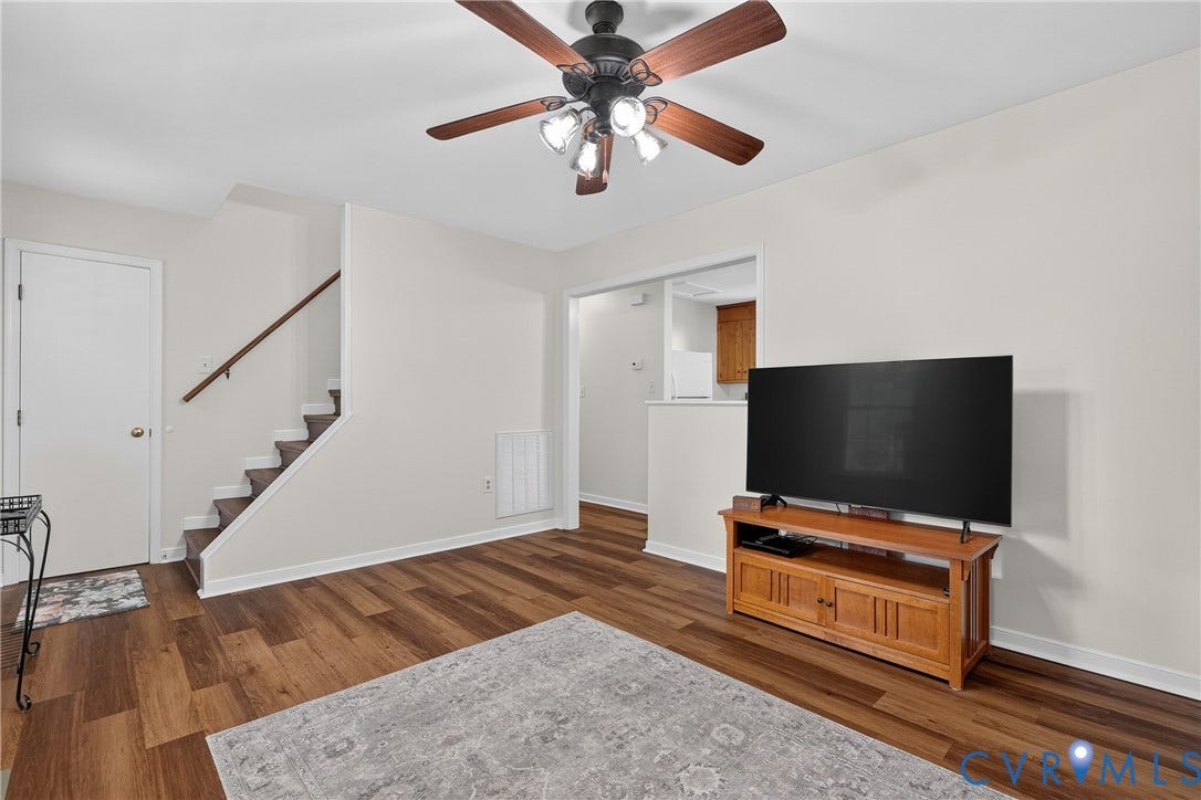 7248 Full Rack Drive, Midlothian, VA 23112 Wood-finish flooring, staircase with wood handrail, ceiling fan with light fixture, and white painted walls