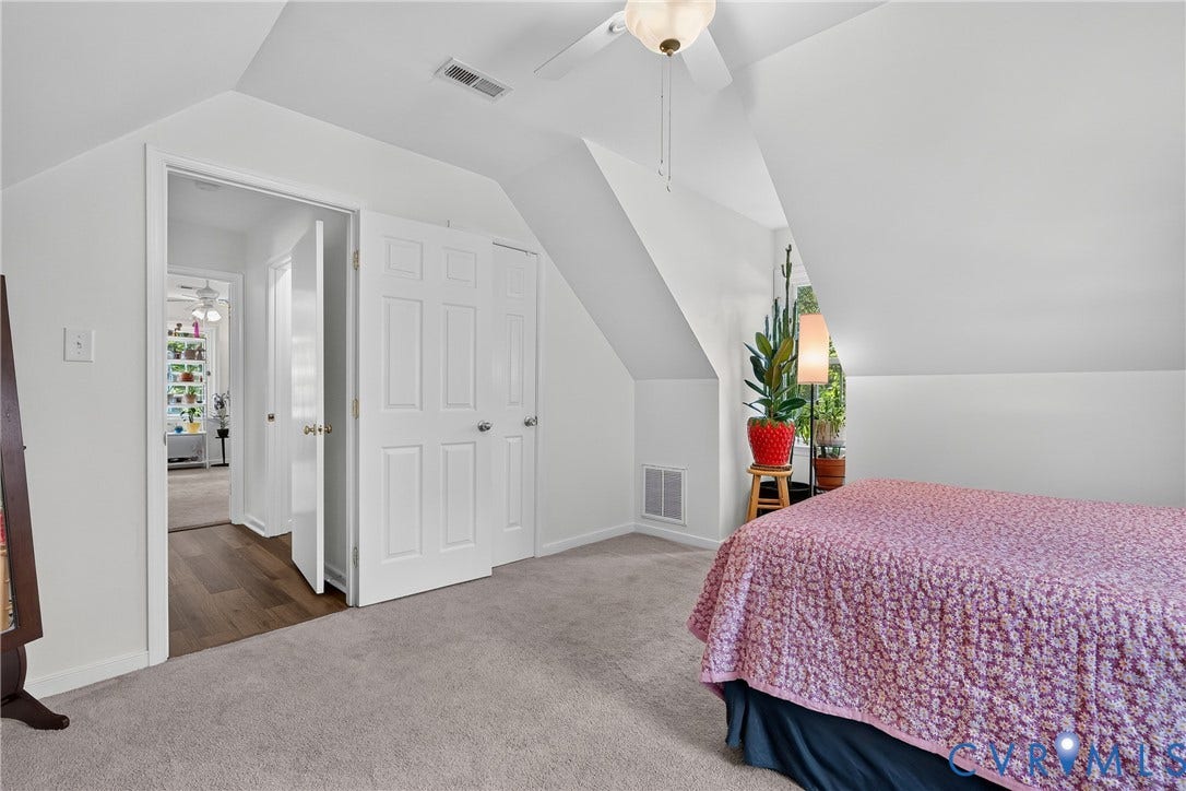 7248 Full Rack Drive, Midlothian, VA 23112 Carpeted flooring, sloped ceiling, ceiling fan, bi-fold closet doors, and wood-finish flooring in the hallway